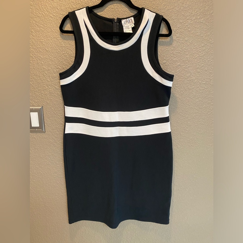 Apart impressions, little black dress with white trim.